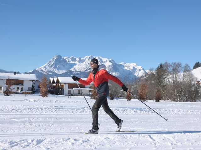 Side view of cross-country skier in cross-country ski run.